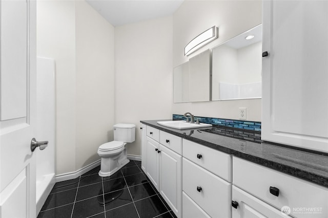 23615 38th Ave E, Spanaway, WA 98387 - bathroom featuring toilet, baseboards, tile patterned floors, and vanity
