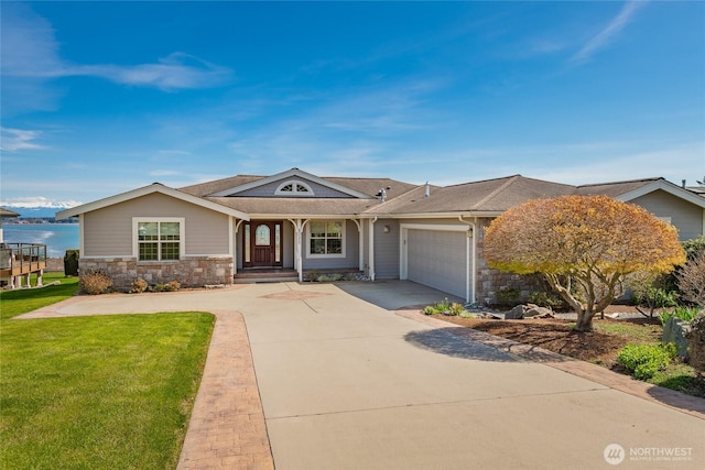8022 Makah Rd, Blaine, WA 98230 - ranch-style home featuring an attached garage, driveway, a front lawn, and stone siding