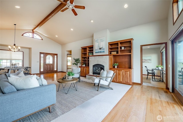 8022 Makah Rd, Blaine, WA 98230 - living area with a healthy amount of sunlight, light wood-style flooring, and a tile fireplace