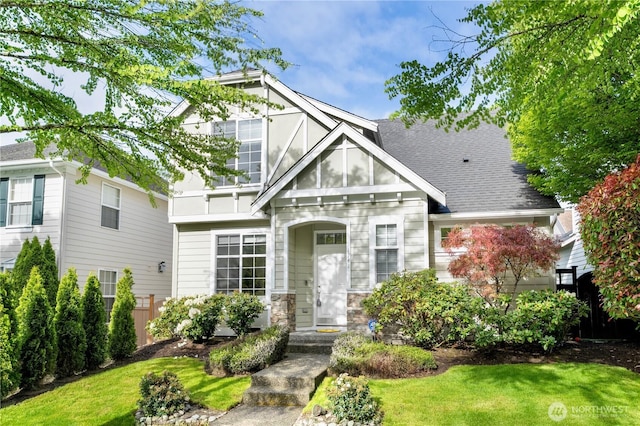 1741 12th Ave NE, Issaquah, WA 98029 - view of front of house with stone siding, fence, a shingled roof, and a front yard