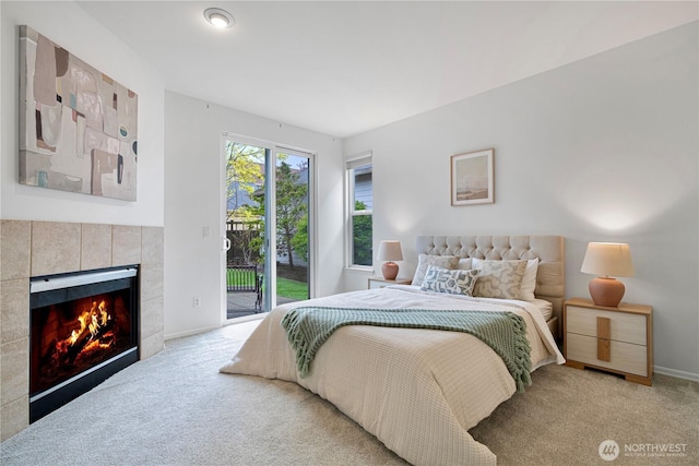 1741 12th Ave NE, Issaquah, WA 98029 - bedroom with carpet floors, baseboards, a tiled fireplace, and access to outside