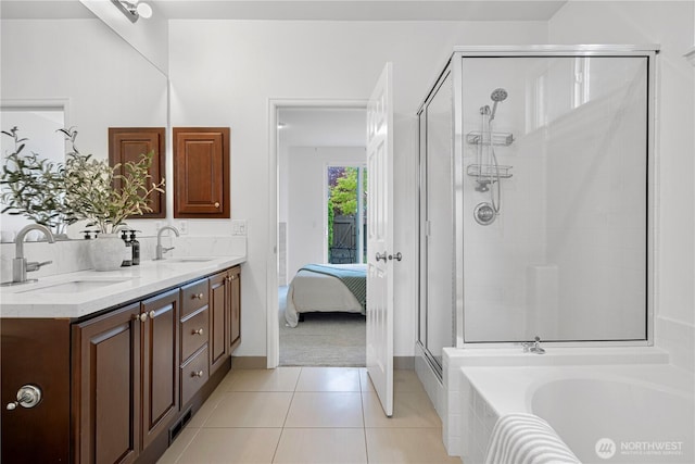 1741 12th Ave NE, Issaquah, WA 98029 - ensuite bathroom featuring double vanity, a sink, a stall shower, and tile patterned floors