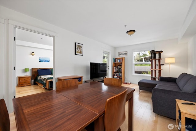 dining area with light wood-style floors