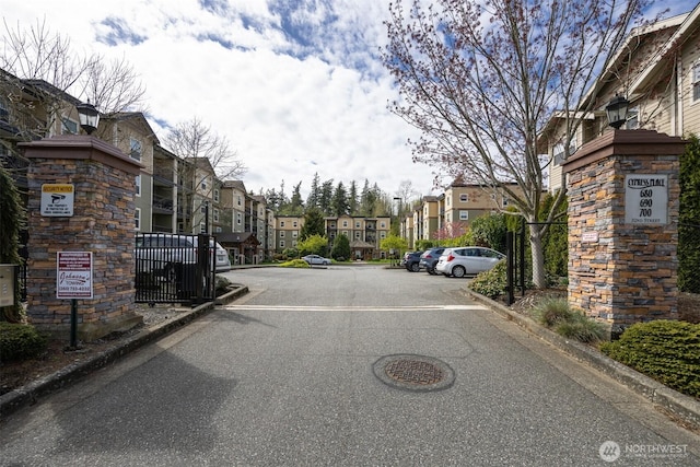 view of street with a residential view and curbs