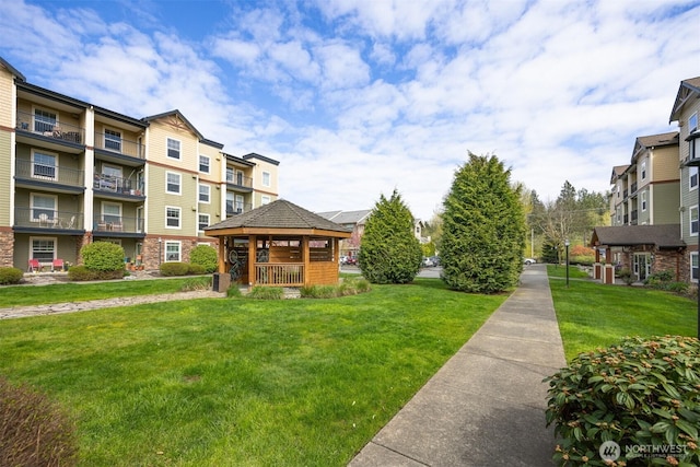 view of community featuring a yard and a gazebo