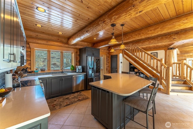 kitchen featuring log walls, light tile patterned flooring, wooden ceiling, a sink, and stainless steel appliances