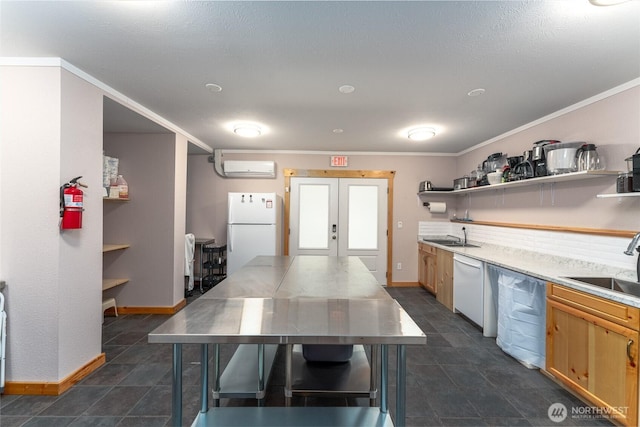 kitchen featuring open shelves, a sink, a wall mounted air conditioner, white appliances, and baseboards