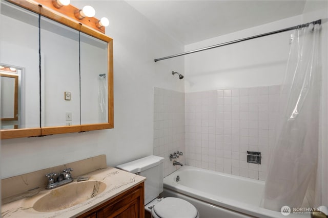 bathroom featuring shower / bath combo with shower curtain, toilet, and vanity