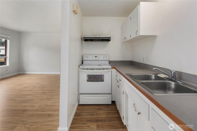 kitchen featuring white electric range, a sink, white cabinets, under cabinet range hood, and dark wood-type flooring