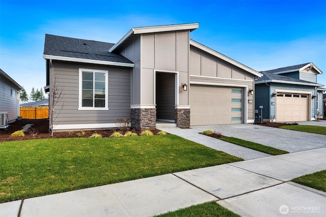 view of front of property featuring stone siding, a front yard, board and batten siding, an attached garage, and driveway