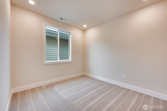 carpeted spare room with baseboards, recessed lighting, and visible vents