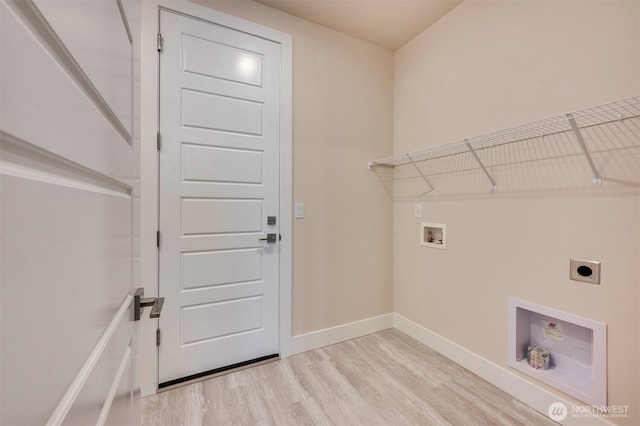 clothes washing area with laundry area, baseboards, hookup for an electric dryer, light wood-style flooring, and washer hookup