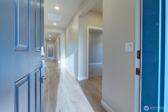 entrance foyer featuring recessed lighting, baseboards, light wood finished floors, and visible vents