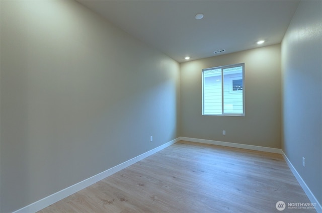 unfurnished room with baseboards, recessed lighting, light wood-style flooring, and visible vents