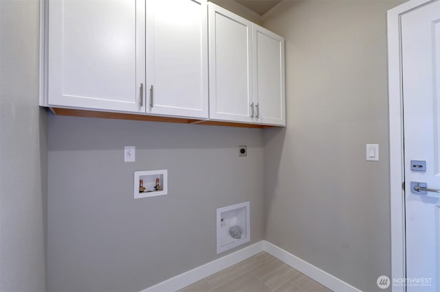 laundry room featuring cabinet space, hookup for an electric dryer, baseboards, and washer hookup