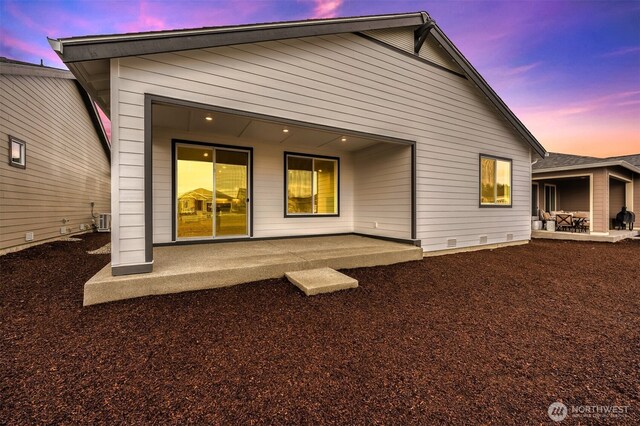 back of house with a patio