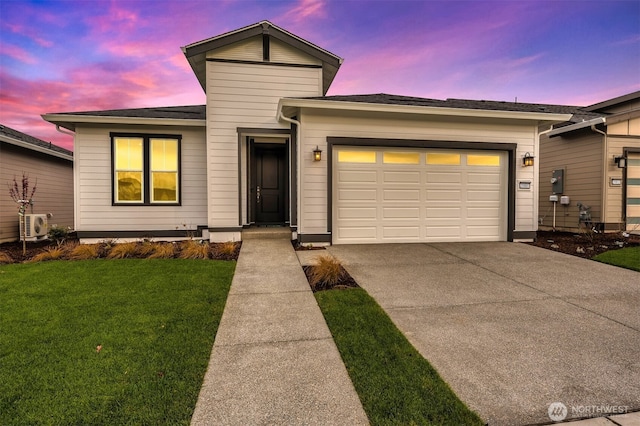view of front of property with a shingled roof, ac unit, a garage, a lawn, and driveway