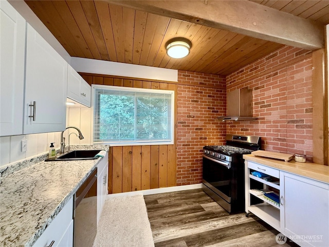kitchen with wood finished floors, white cabinets, wooden ceiling, a sink, and appliances with stainless steel finishes