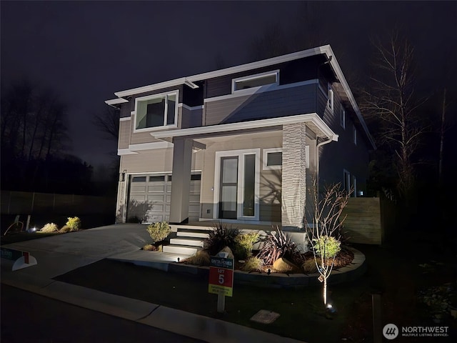 11612 SE 196th St Unit 7, Kent, WA 98031 - view of front of home featuring a garage, concrete driveway, and stone siding