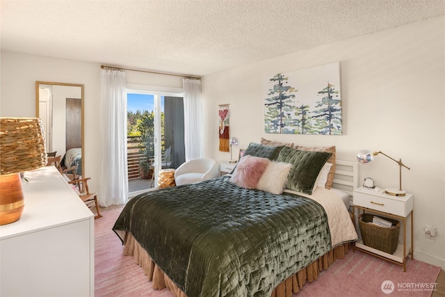 bedroom with a textured ceiling, light colored carpet, and access to exterior