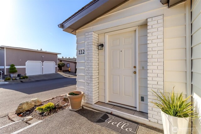property entrance with brick siding