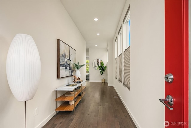 hallway featuring baseboards, dark wood-style flooring, and recessed lighting