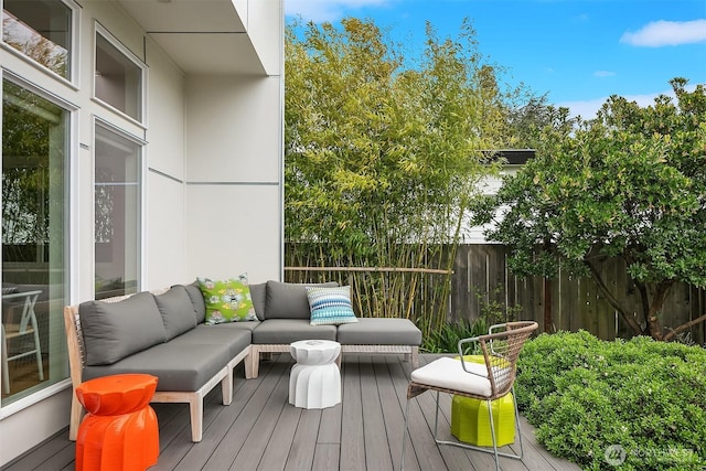 deck with fence and outdoor lounge area