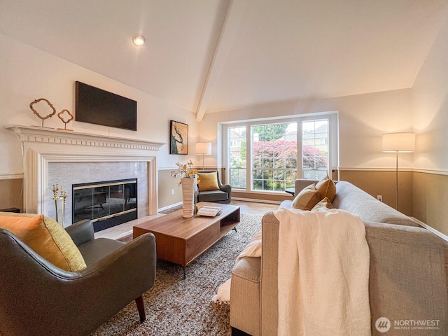 living room featuring a premium fireplace and vaulted ceiling with beams