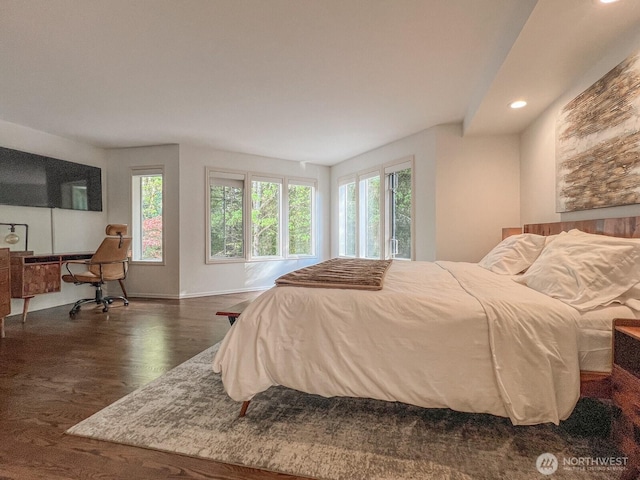 bedroom featuring baseboards, multiple windows, recessed lighting, and dark wood-type flooring