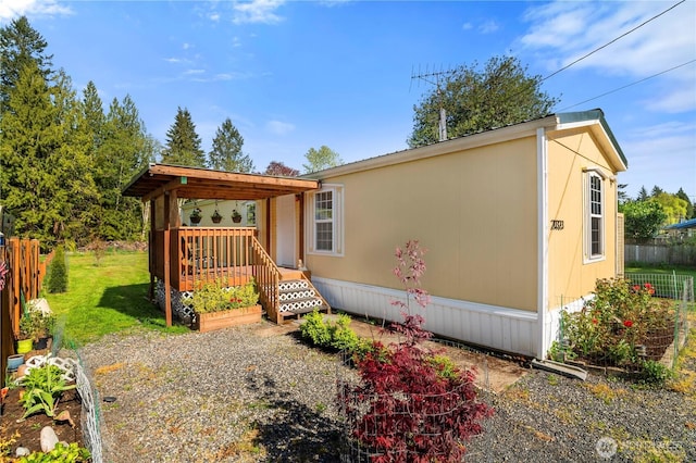 20323 Jordan Rd, Arlington, WA 98223 - manufactured / mobile home with a wooden deck