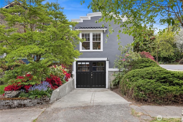 exterior space featuring stucco siding