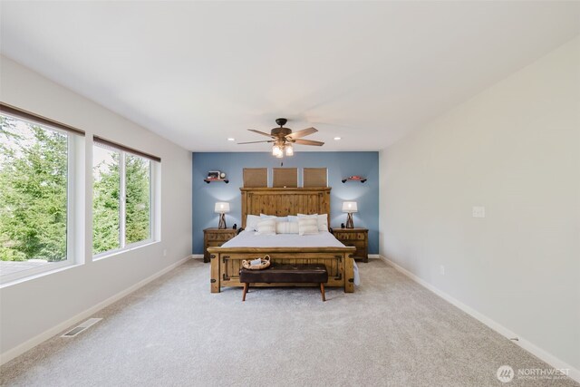 bedroom with light colored carpet, a ceiling fan, baseboards, recessed lighting, and visible vents