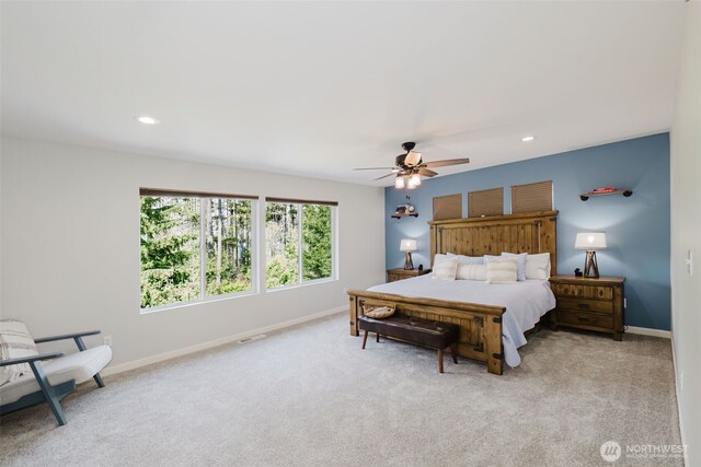 bedroom featuring recessed lighting, baseboards, visible vents, and light carpet