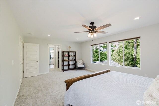 bedroom with baseboards, light carpet, and recessed lighting