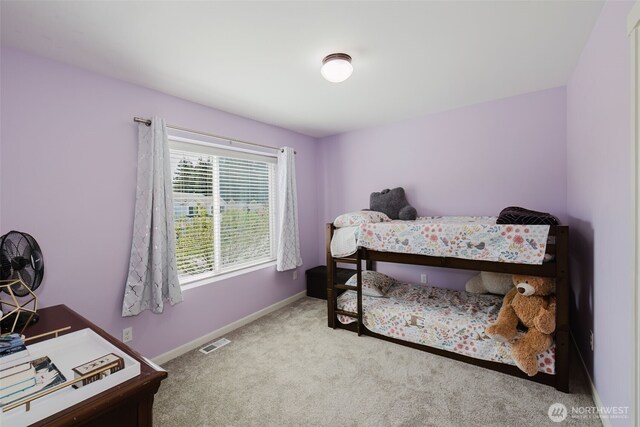 bedroom with visible vents, carpet flooring, and baseboards