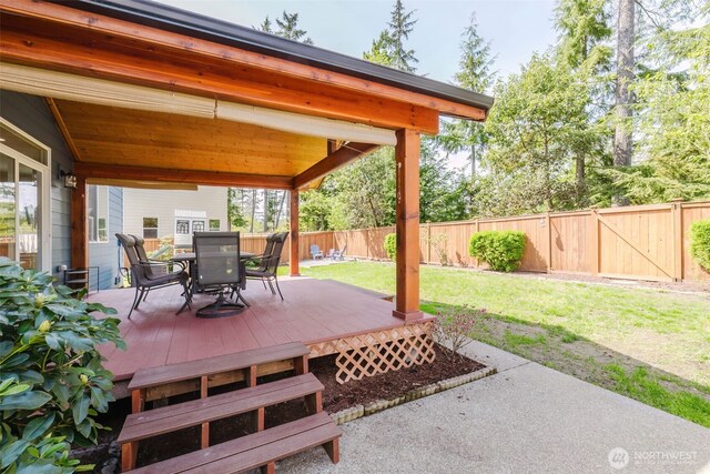 view of patio / terrace with outdoor dining area, a fenced backyard, and a deck