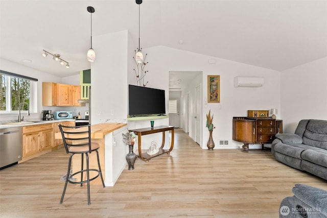 living room featuring visible vents, baseboards, an AC wall unit, light wood-style flooring, and vaulted ceiling
