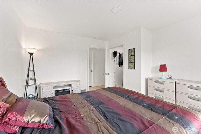 bedroom featuring visible vents