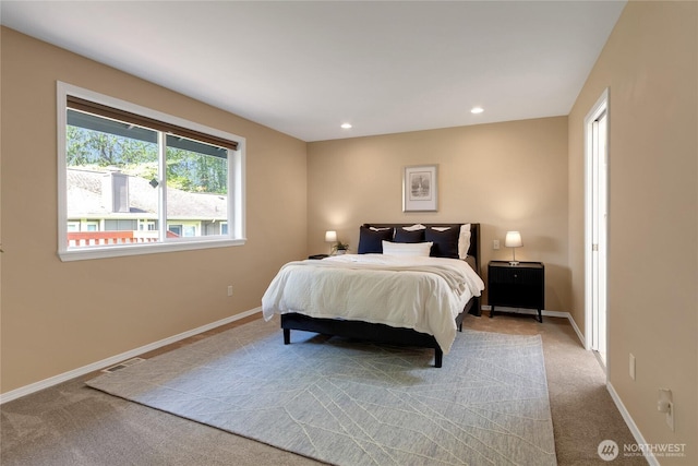 carpeted bedroom featuring recessed lighting, baseboards, and visible vents