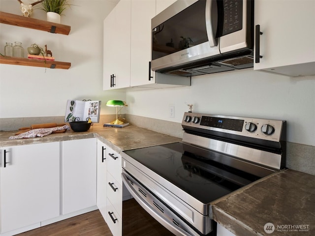 159 Bootjack Ln, Kelso, WA 98626 - kitchen featuring open shelves, dark wood-style floors, white cabinets, and stainless steel appliances