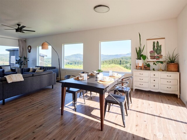 159 Bootjack Ln, Kelso, WA 98626 - dining space featuring a mountain view, ceiling fan, and wood finished floors