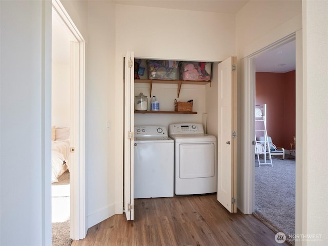 159 Bootjack Ln, Kelso, WA 98626 - laundry area with laundry area, carpet flooring, washing machine and dryer, and wood finished floors
