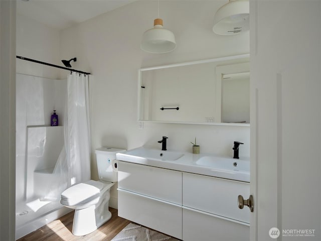 159 Bootjack Ln, Kelso, WA 98626 - bathroom with a shower with curtain, a sink, and wood finished floors