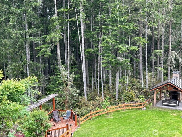 view of yard featuring a wooden deck and a gazebo