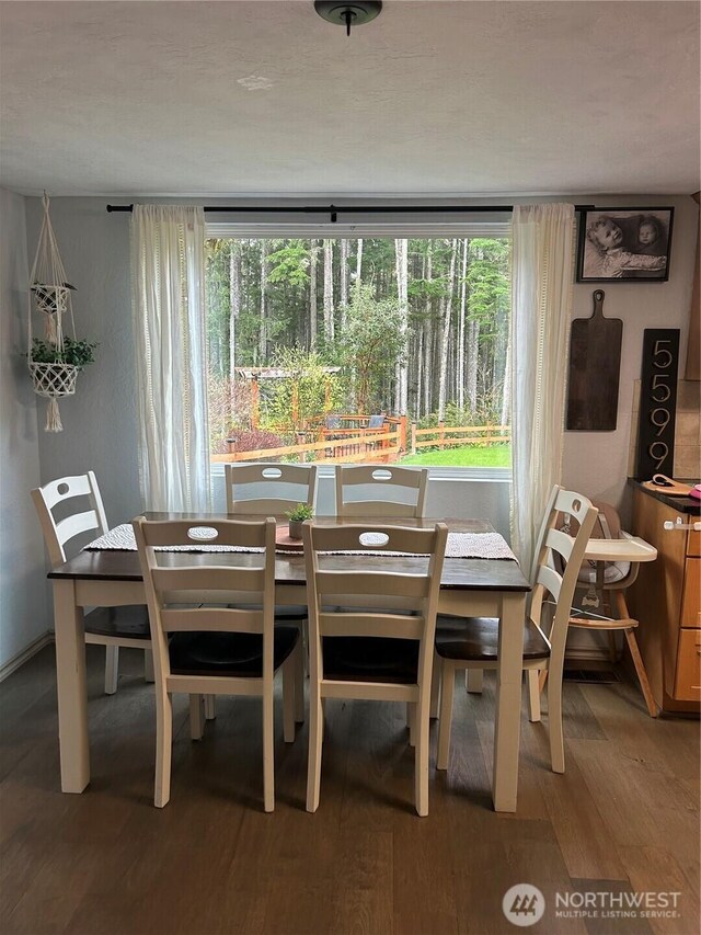 dining area featuring wood finished floors
