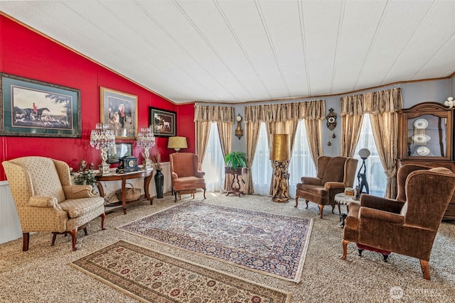 living area with carpet floors, plenty of natural light, and vaulted ceiling