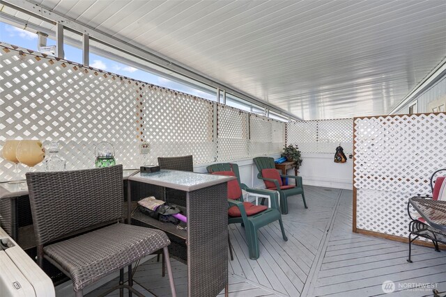 wooden deck with outdoor dining area