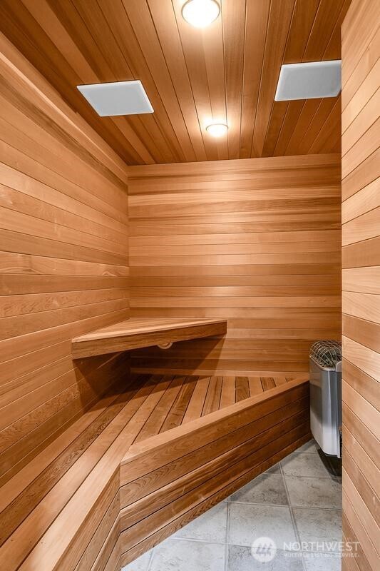 view of sauna with tile patterned flooring and a skylight