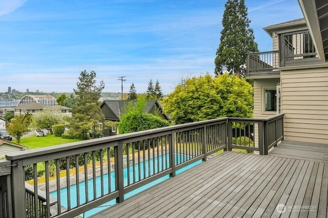 wooden terrace featuring an outdoor pool
