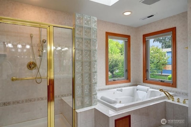 full bath featuring a jetted tub, visible vents, and a shower stall